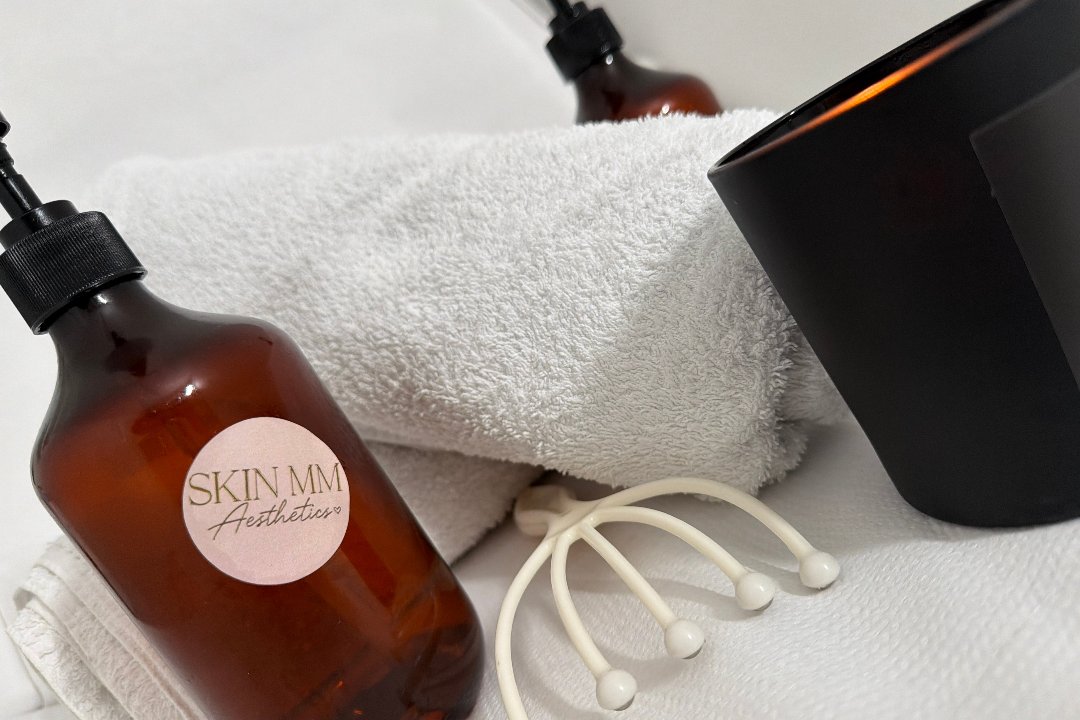 Skin MM Aesthetics products and fresh towels in the treatment room